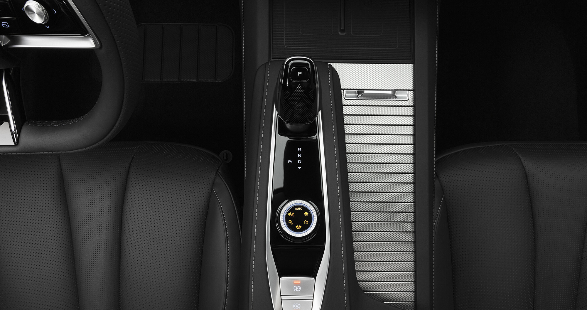 Top down view of MG QS gear shifter and drive mode selector