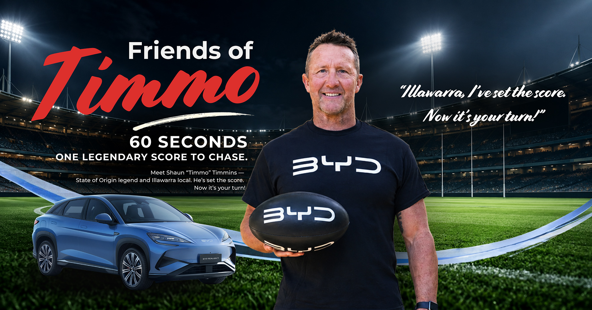 Friends of Timmo. Shaun Timmo Timmins holding a BYD football beside a BYD SEALION 7. Illawarra, I've set the score. Now it's your turn!